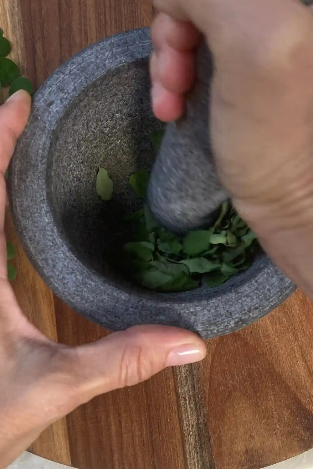 essential gardening tools (4) grinding herbs with a mortar and pestle