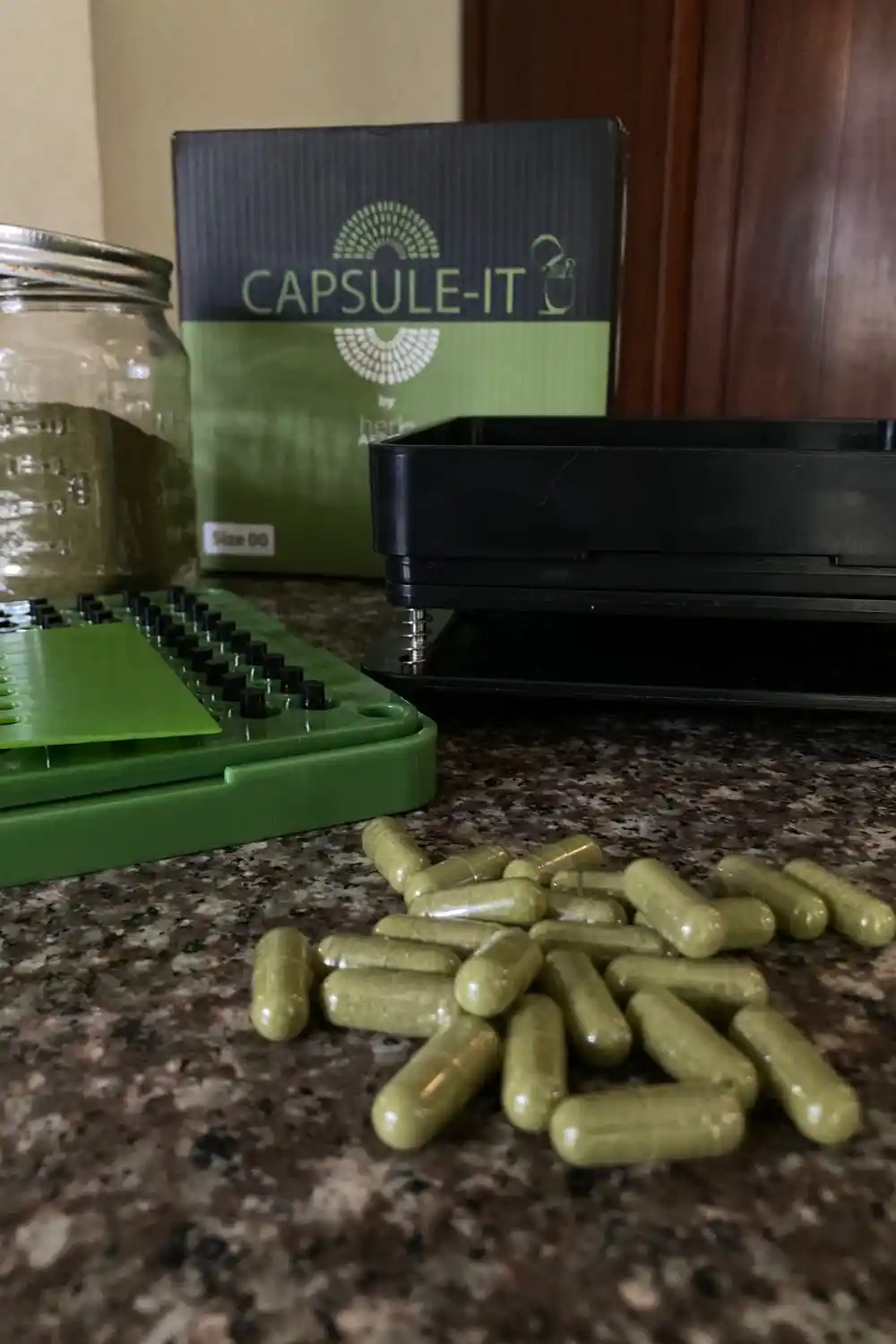 essential gardening tools (5) Capsule It Capsule filling machine with filled capsules of powdered herbs